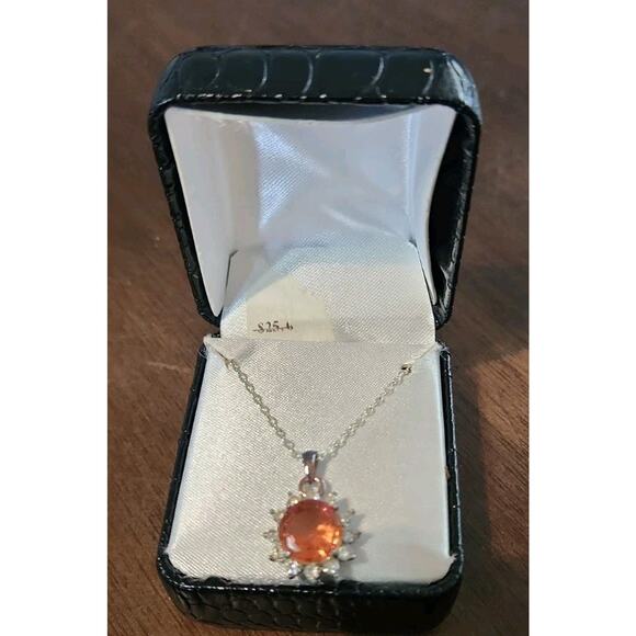 Unbranded Jewelry - silver necklace W/peach sunstone pendant surrounded by a halo of Accent Stones